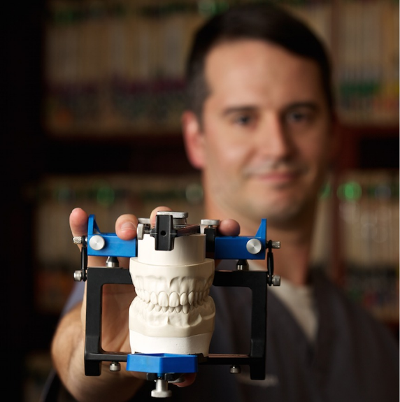 doctor showing patient a smile